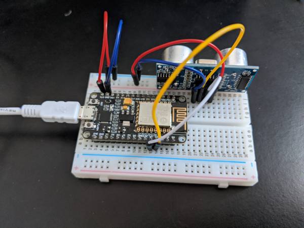  NodeMCU on a breadboard connected to a range Sensor